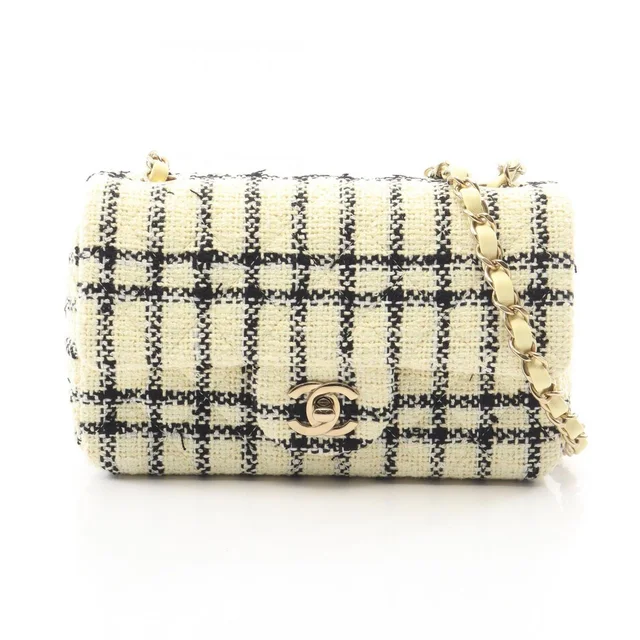 Chanel Shoulder Bag Mini Quilted 20 Cream Black Fabric Chain in Black from The Reluxe