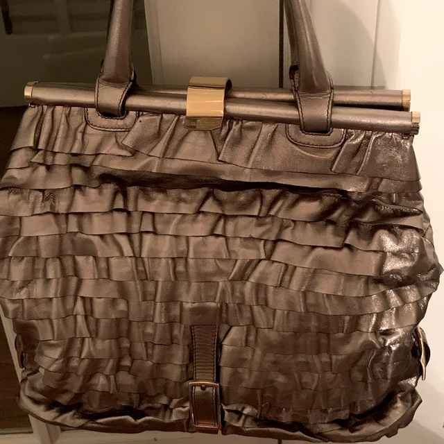 Valentino Garavani handbags in gold from Poshmark, photo 1 of 1