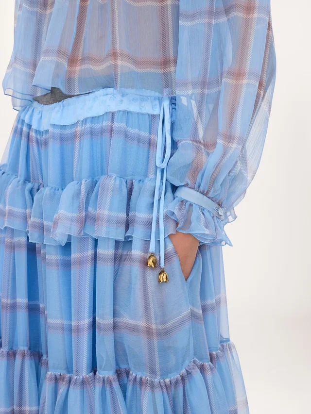 Chloé Ruffled Check Wide-Leg Pants in Silk 100% Description: Fluid pleated trousers in check-print organic silk mousseline with a silk-mix lining, featuring a gathered, tiered…, photo 6 of 7 from SENSER