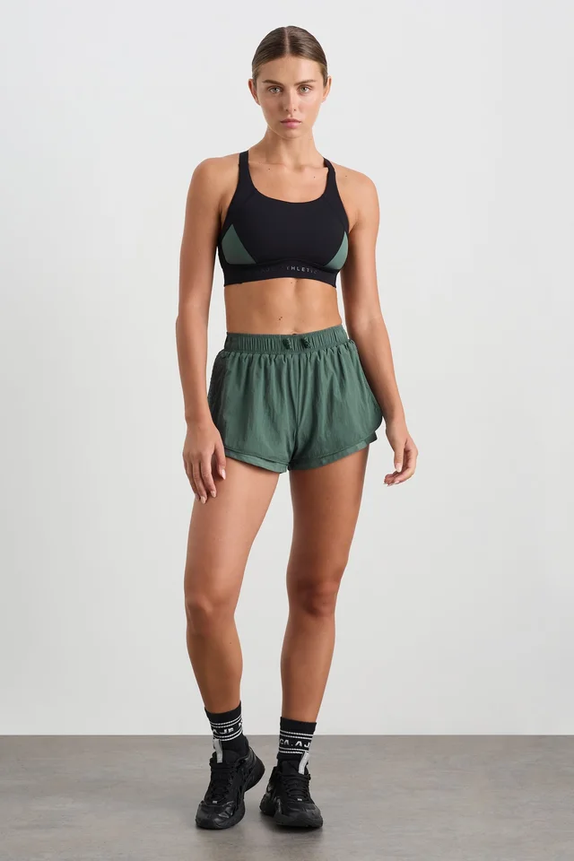 Athletica Perforated Spray Shorts 019 in Green from Aje, photo 1 of 1