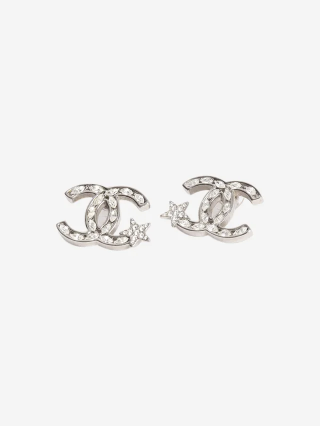 Chanel Silver CC shooting star earrings in Silver from Sign of the Times
