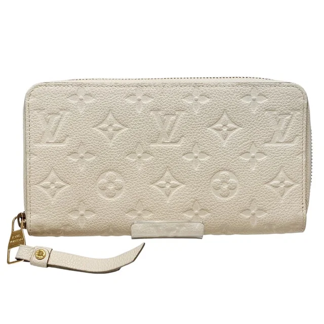 Louis Vuitton Portefeuille Secret Long Monogram Empreinte Bifold Wallet from The Reluxe