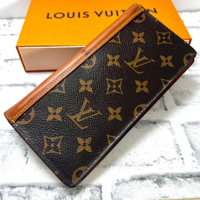 Louis Vuitton Monogram Portefeuille Plaza NM Wallet from The Reluxe