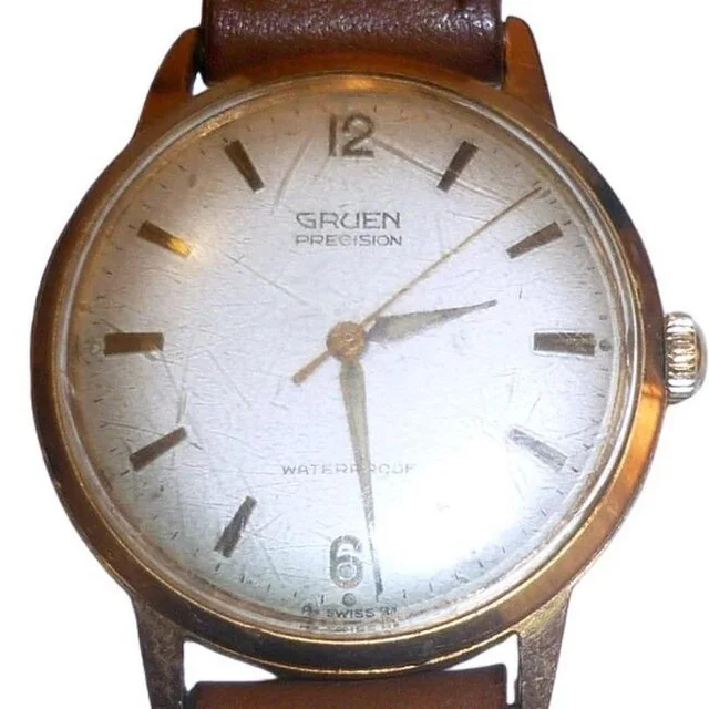 Jacquemus Men's Analogue Watch - Gold/Brown in brown|red|gold from Depop, photo 1 of 1