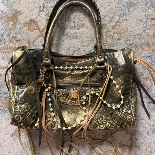 Balenciaga Women's Shoulder bags - Gold/Brown in red|brown|gold from Depop, photo 1 of 1