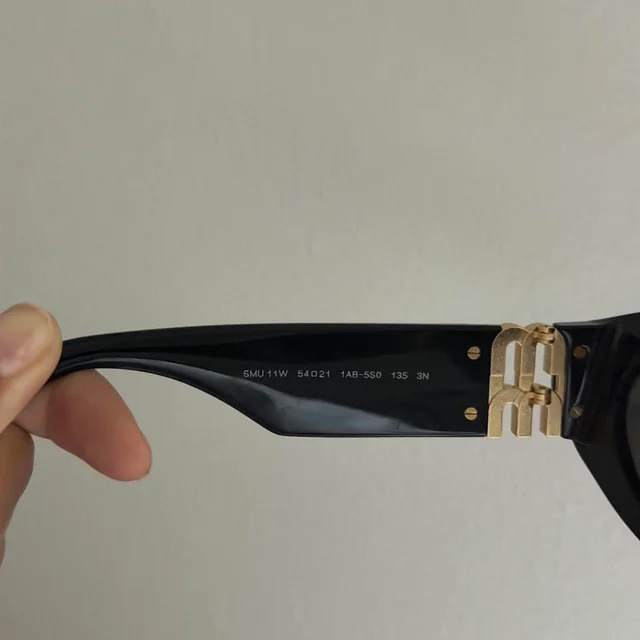 Miu Miu Women's Sunglasses - Black in black from Depop, photo 4 of 8