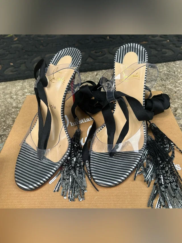 Christian Louboutin Black, Clear Striped Tassel Lace-Up Heels in black|white from Poshmark