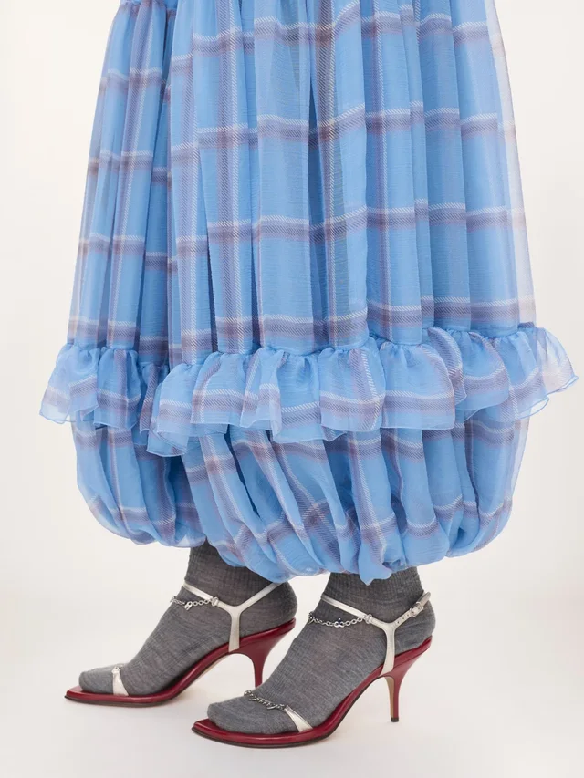 Chloé Ruffled Check Wide-Leg Pants in Silk 100% Description: Fluid pleated trousers in check-print organic silk mousseline with a silk-mix lining, featuring a gathered, tiered…, photo 7 of 7 from SENSER