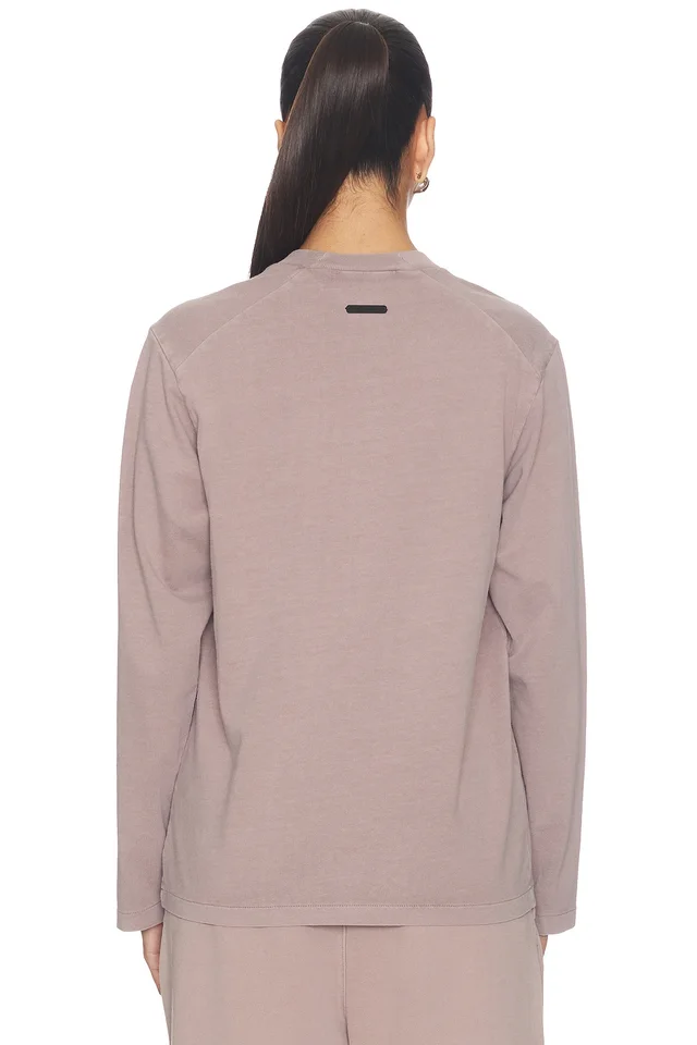 Fear of God ESSENTIALS Campus Classic Long Sleeve Tee in Faded Mauve, photo 3 of 4 from REVOLVE (Canada)
