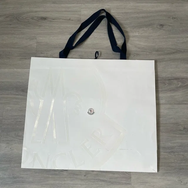 Moncler Xl Paper Bag in white from Poshmark