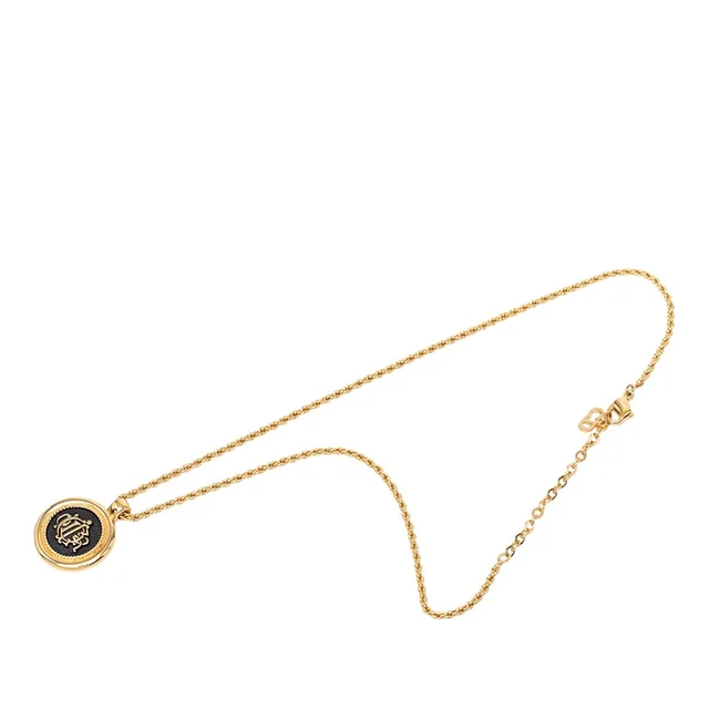 Dior Plated Enamel Logo Round Pendant Necklace in gold from Poshmark, photo 1 of 1