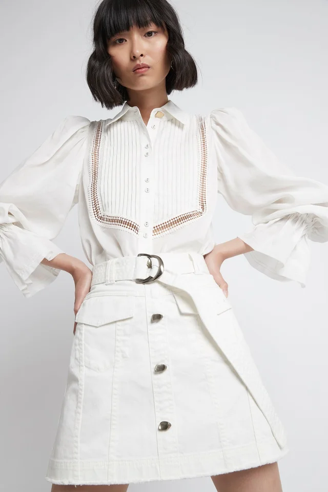 AJE Arlow Denim Mini Skirt in White from Aje, photo 1 of 1