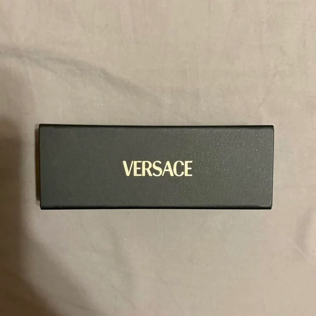 Versace Women's Sunglasses - Black in black from Depop, photo 4 of 4