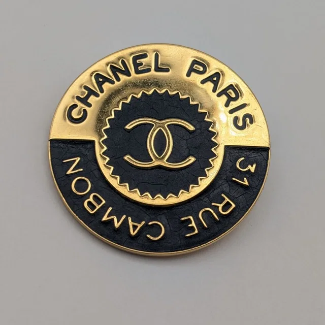 Chanel Brooch CC Logo Cambon Gold Black First Era Vintage in Black from The Reluxe