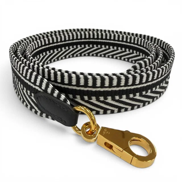 Hermès Bandouliere Sangle Caval 25 Gold Shoulder Strap Black White in Black Canvas from The Reluxe