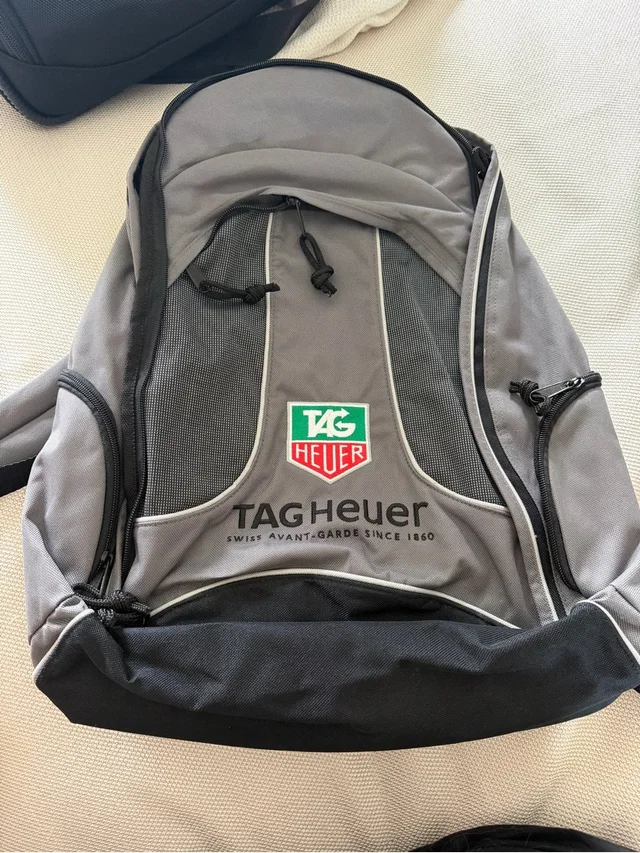 TAG Heuer Gray And Black Logo Backpack With Green & Red Badge in black|gray from Poshmark