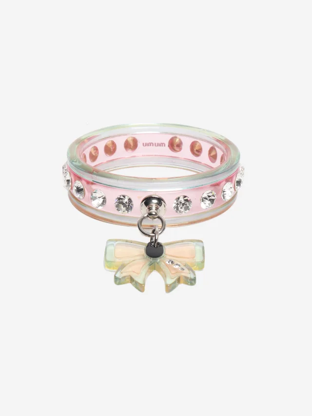 Miu Miu Pink bow detail plastic bangle in Pink from Sign of the Times