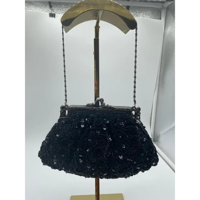 Moynat Women's Clutch bags - Black in black from Depop, photo 1 of 1