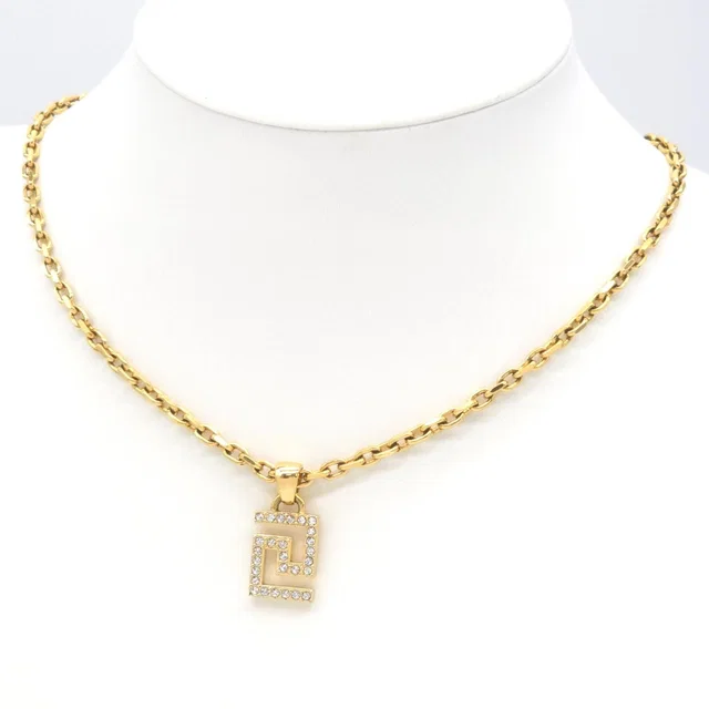 Versace Greca Pendant Crystal Medusa Charm Gold Tone Metal in Gold from The Reluxe
