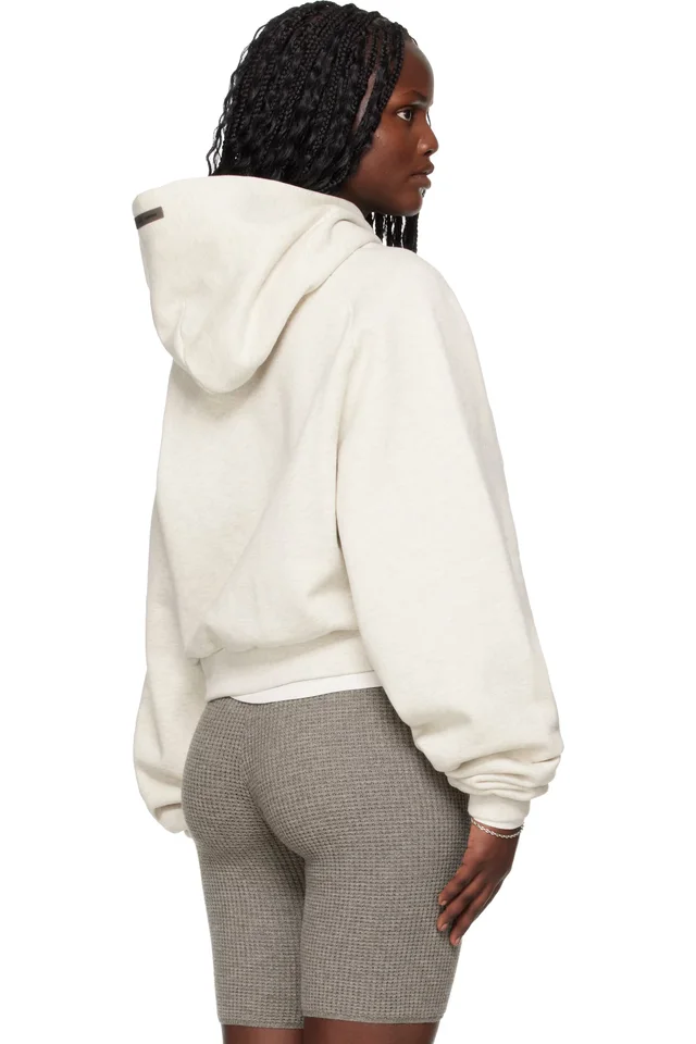 Fear of God ESSENTIALS Gray Holiday Embossed 90s Raglan Hoodie, photo 3 of 4 from SSENSE