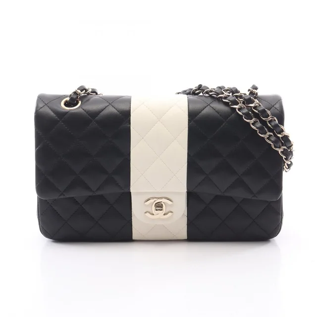 Chanel Shoulder Bag Quilted Double Flap Black White Lambskin Bicolor Chain in Black Lambskin from The Reluxe