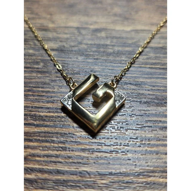 Givenchy Women's Jewelry - Gold/Silver in gold|silver|gray from Depop, photo 1 of 1