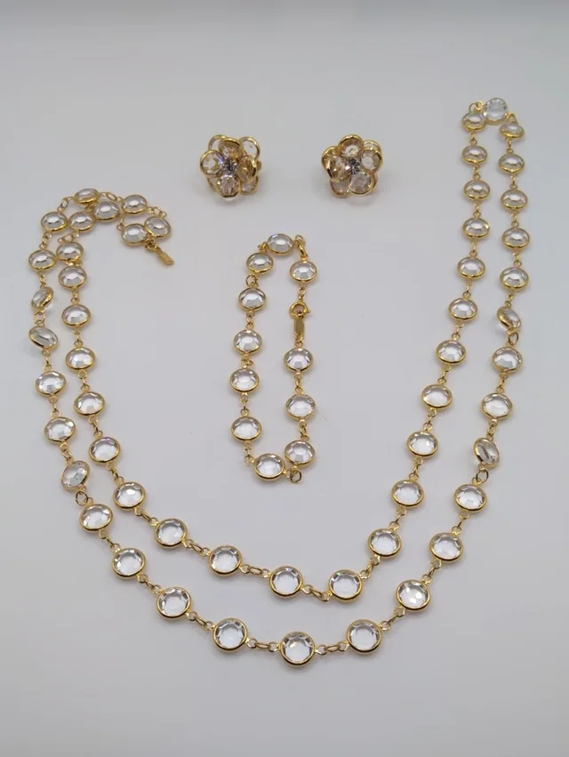 Swarovski Clear Crystal Long Necklace, Bracelet, And Matching Clip Earrings in gold from Poshmark
