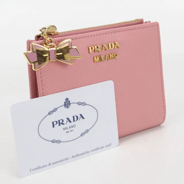Prada Saffiano Leather Bifold Wallet Calfskin in Saffiano leather from The Reluxe