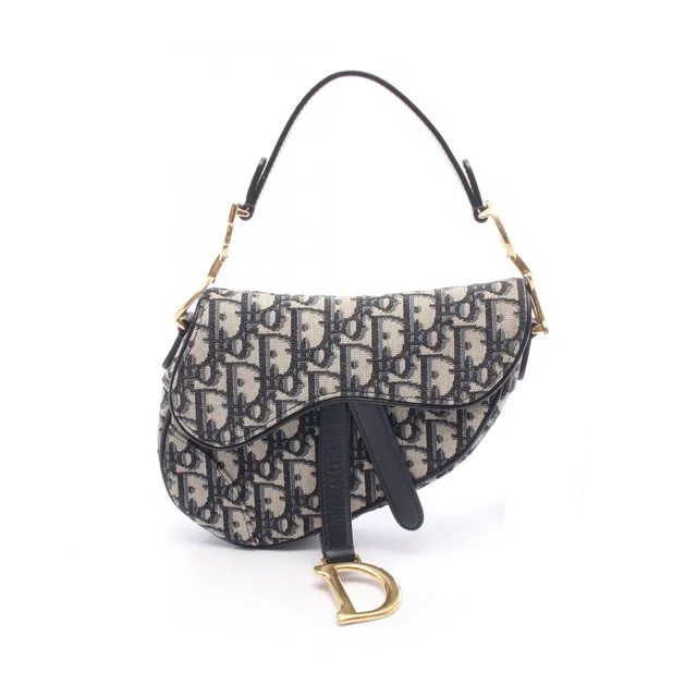 Dior Handbag Saddle Oblique Ivory Navy Canvas Leather Bag Mini in White Canvas from The Reluxe
