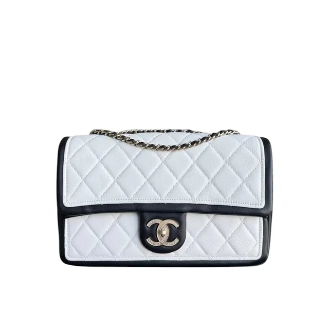 Chanel Seasonal Flap - 25cm Quilted Lambskin Bi-color White Black Gold Hardware in Black Lambskin from Luxury Promise