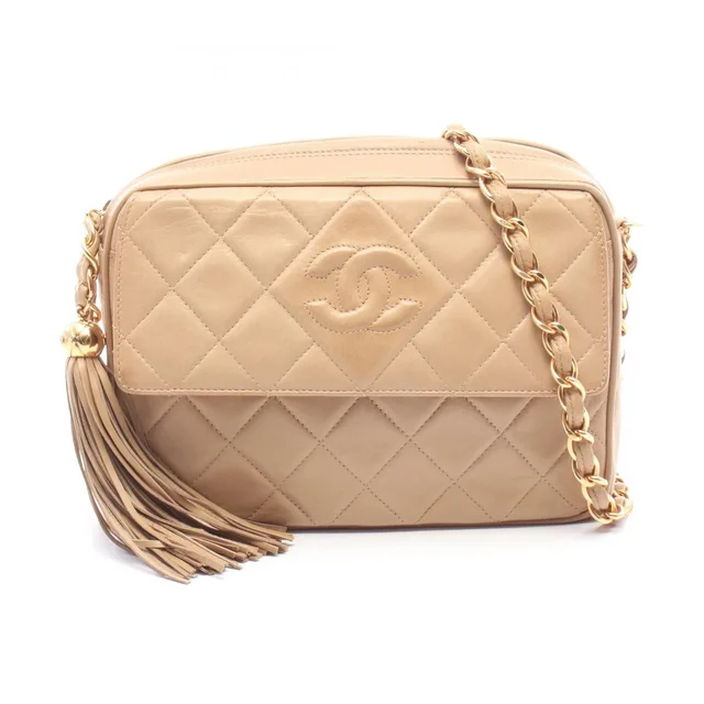 Chanel Shoulder Bag Quilted CC Logo Tassel Beige Lambskin Fringe Chain in Beige Lambskin from The Reluxe