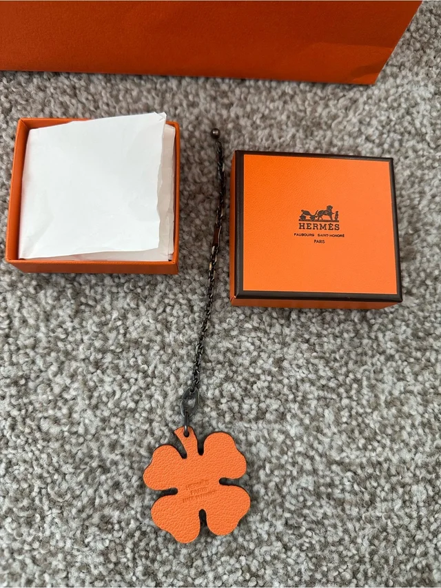 Hermès Orange Leather Clover Pendant Charm. Authentic in orange|brown|red Leather from Poshmark, photo 3 of 7