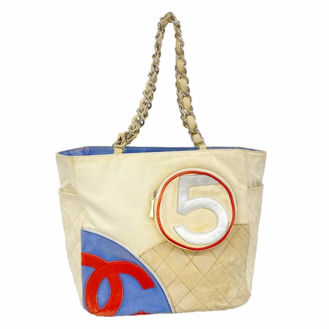Chanel Chain Tote Bag Canvas White Blue Silver in White Canvas from The Reluxe