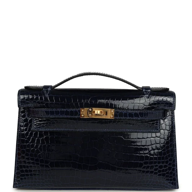 Hermès Kelly Pochette Bleu Saphir Shiny Porosus Crocodile Gold Hardware in Blue Crocodile from Madison Avenue Couture