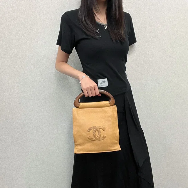 Chanel CC Logo Perforated Wood Handle Handbag Leather Yellow Brown Gold Vintage in Brown Leather from The Reluxe