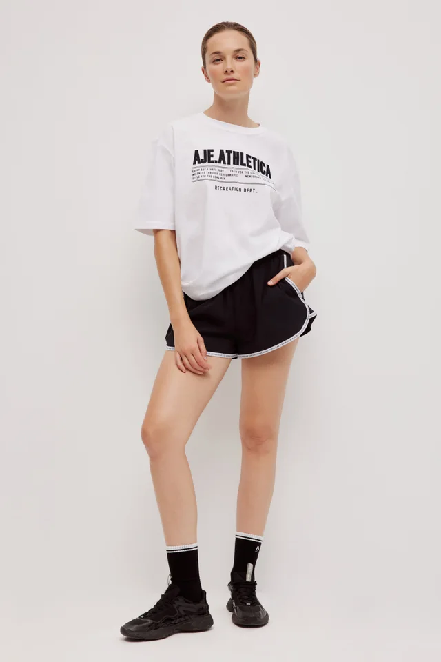 Athletica Logo Tape Running Short 643 in Black from Aje, photo 1 of 1