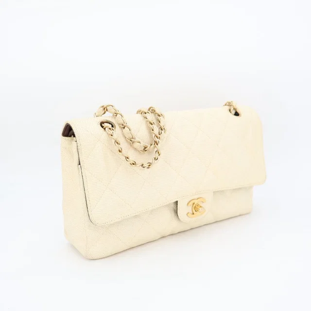 Chanel Quilted Chain Shoulder Bag in Coated canvas from The Reluxe