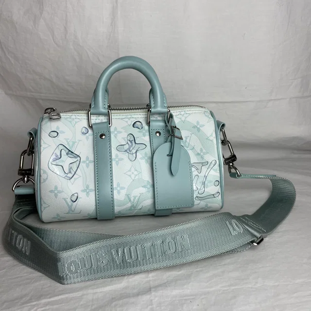 Louis Vuitton Keepall Bandoulière 25 Monogram Aquagarden in coated canvas from Reowned