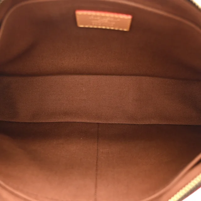 Louis Vuitton Reverse Monogram Drip Pochette Voyage Souple in Coated canvas from FASHIONPHILE, photo 5 of 8