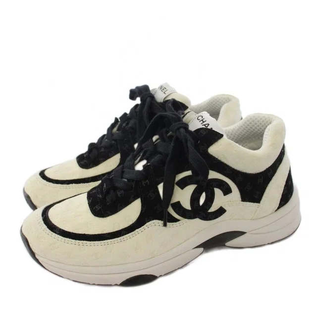 Chanel CC Logo Sneakers Suede White Black in Black Suede from The Reluxe