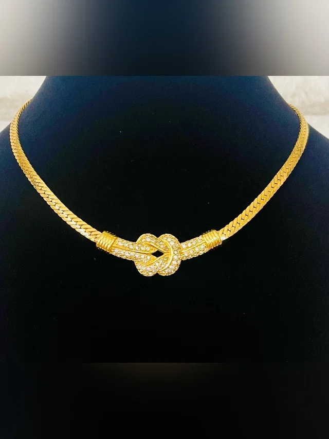 Swarovski Knot Necklace With Crystal Accents 16” Long in gold from Poshmark