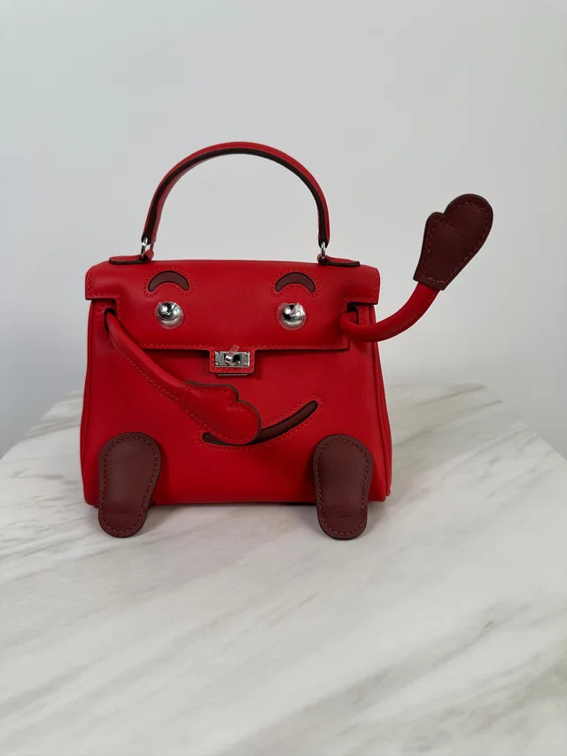 Hermès Kelly Doll Rouge Radieux Swift Palladium Hardware in Red Swift leather from Luxury Promise