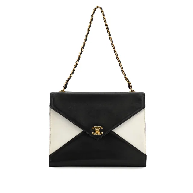 Chanel Vintage Chain Shoulder Bag Black White Lamb Skin Gold Hardware in Black from Luxury Promise