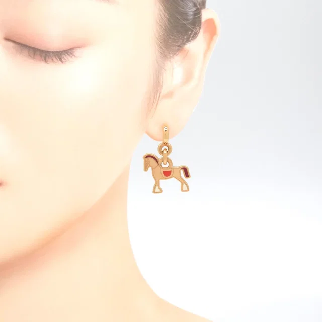 Hermès Cheval Earrings Gold Pre Raqqa Metal 3.35 Booklet in Gold from The Reluxe