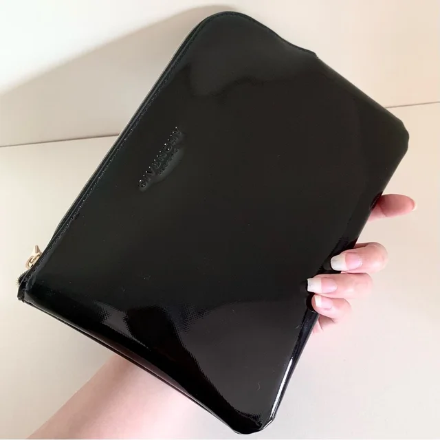 Givenchy Patent Zippy Pouch Clutch in black|gold Patent leather from Poshmark, photo 1 of 1