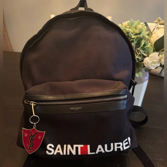 Backpack With Logo And Ysl Key Chain Authentic in black from Poshmark, photo 1 of 1