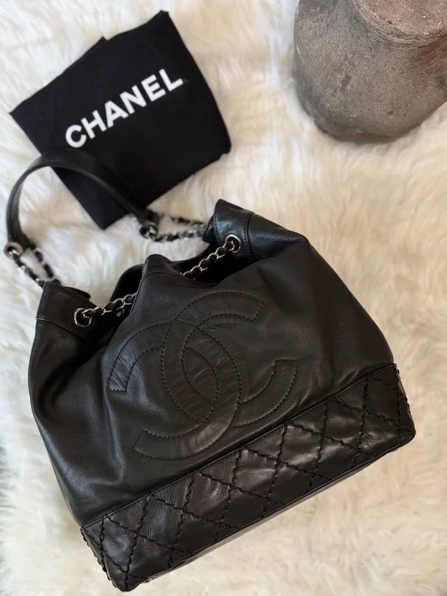 Chanel Surpique Cc Drawstring Calfskin Bucket Bag in black Calfskin from Poshmark, photo 1 of 1