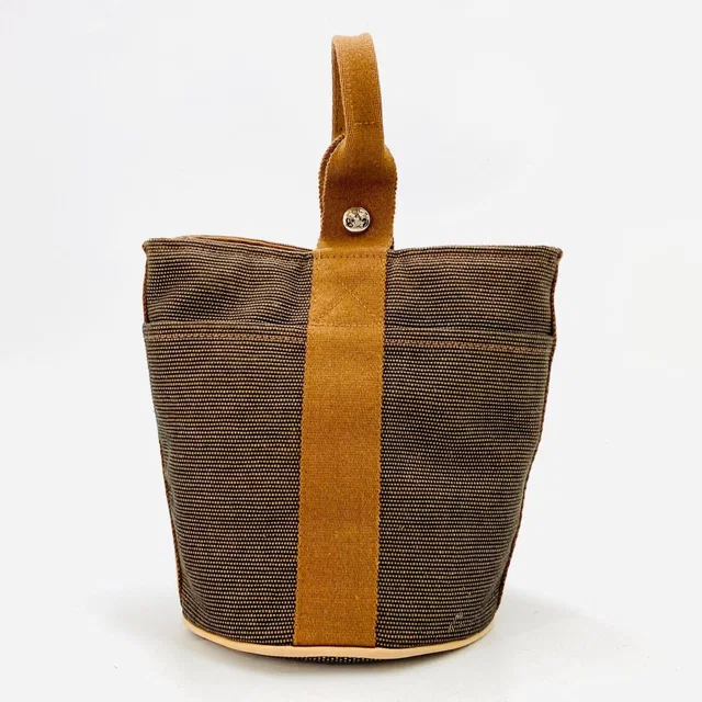 Hermès Saxophone PM Bucket Handbag in Canvas from The Reluxe