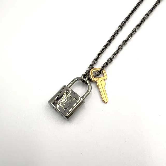 Louis Vuitton Padlock Metal Yellow Gold Black Necklace in Black from The Reluxe