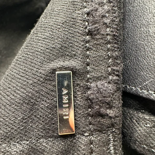 Amiri Mx2 Skinny-Fit Distressed Jeans in Black Cotton in black, photo 3 of 6 from ShopSimon